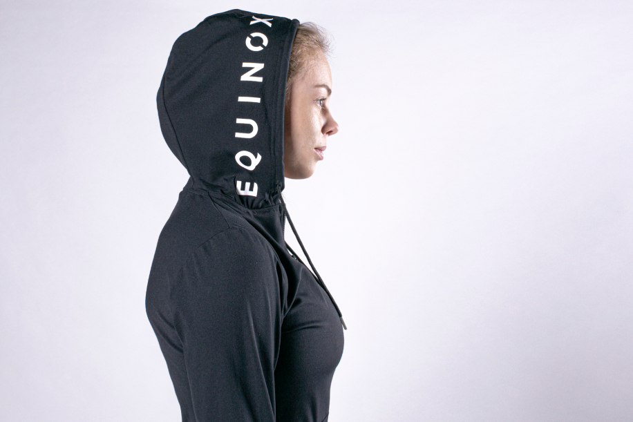 Woman in Equinox hoodie